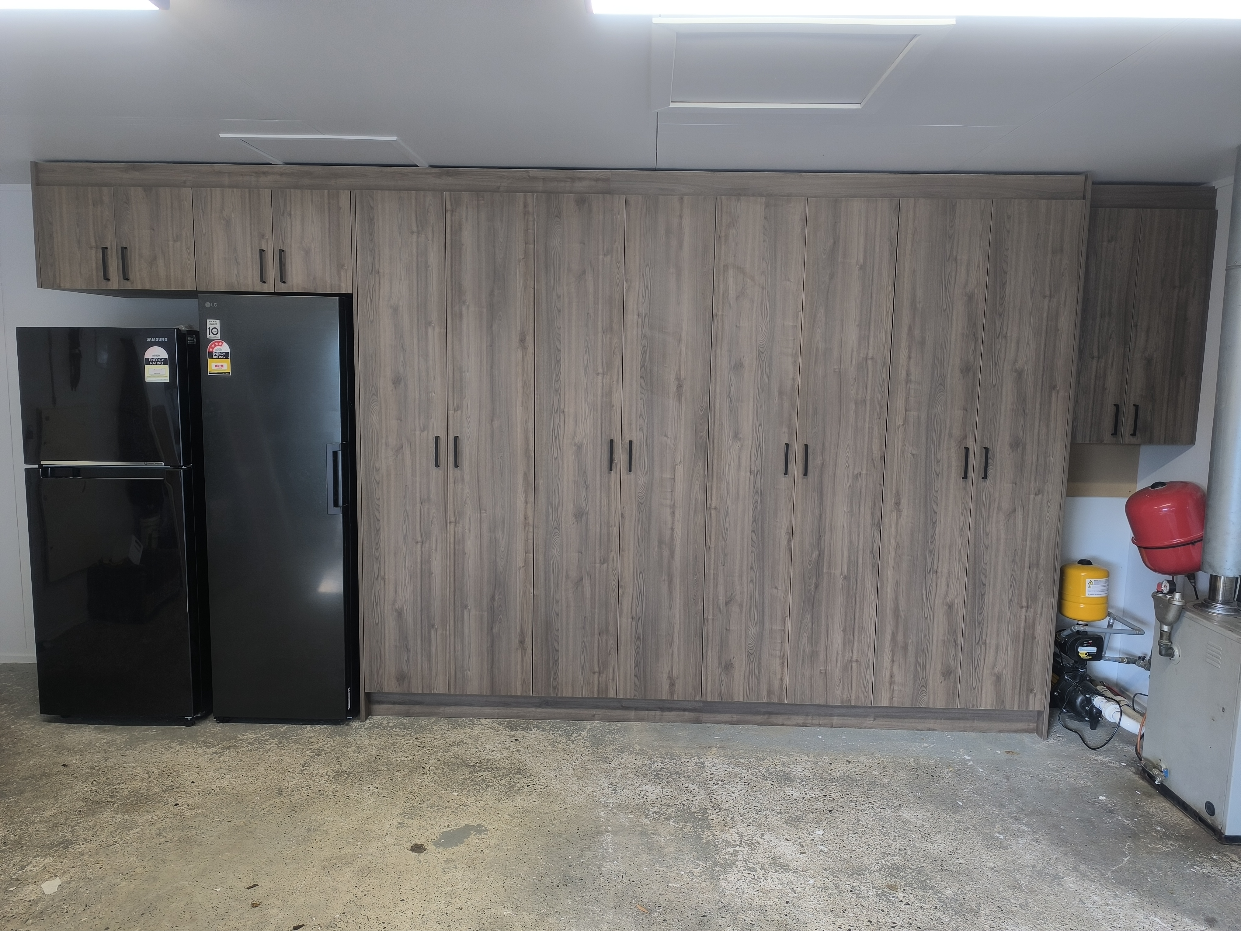 Garage wall after custom storage cabinetry